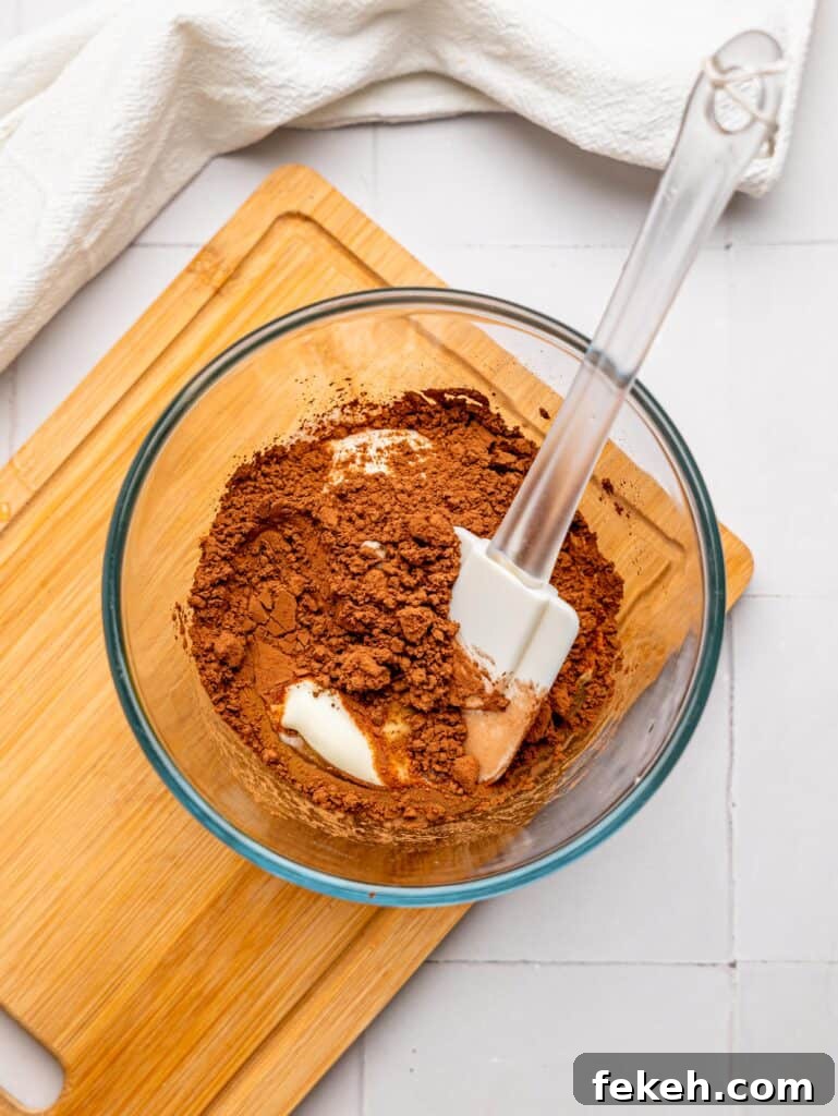 No-Bake Mini Triple Chocolate Cheesecakes Recipe 13 Chocolate Cheesecake Filling Ingredients in a bowl.