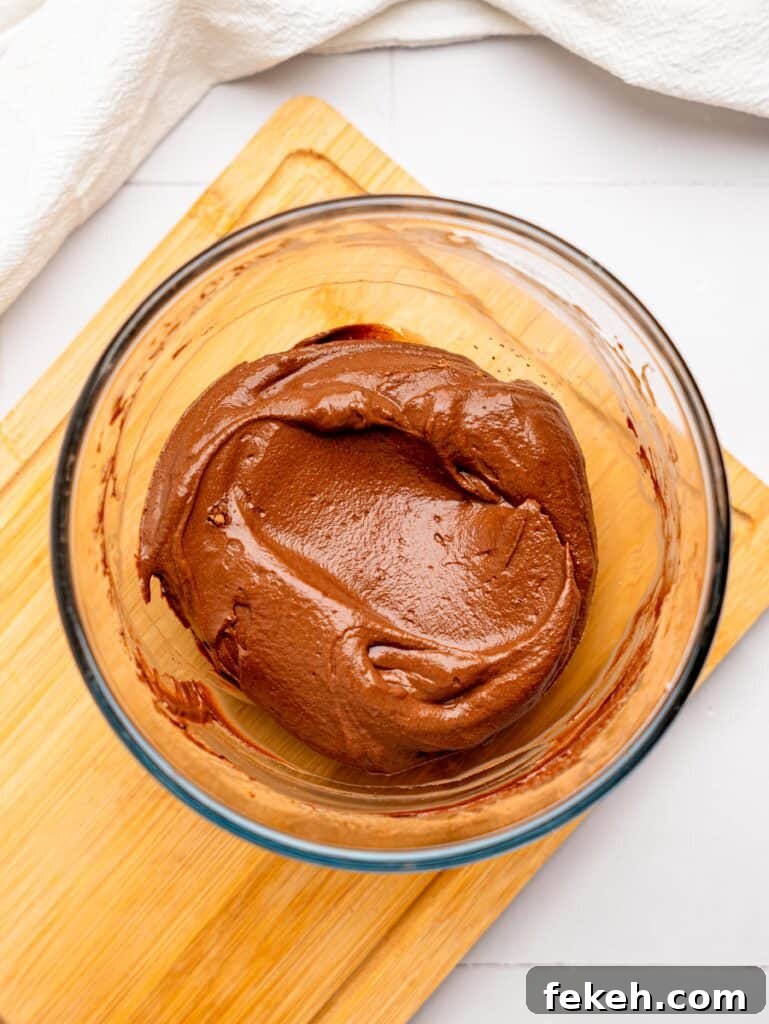 No-Bake Mini Triple Chocolate Cheesecakes Recipe 14 Chocolate Cheesecake Filling in a bowl.