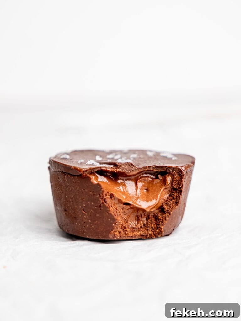 No-Bake Mini Triple Chocolate Cheesecakes Recipe 19 Mini Chocolate Cheesecake with a bite missing.