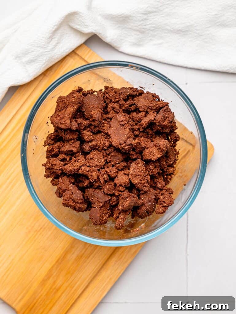 No-Bake Mini Triple Chocolate Cheesecakes Recipe 10 No Bake Chocolate Cheesecake Crust mixture in a bowl.