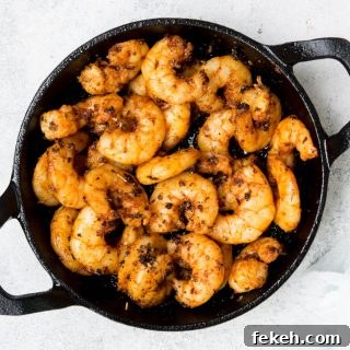 blackened keto shrimps in a cast-iron skillet