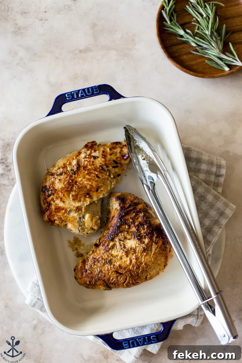 Overhead photo of a baking dish with two cooked turkey tenderloins
