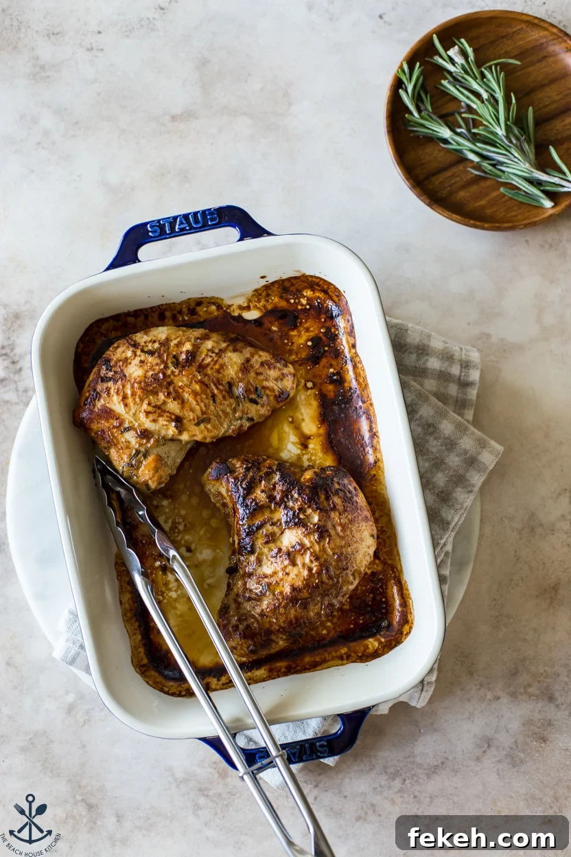Overhead photo of cooked turkey tenderloins in a blue baking dish