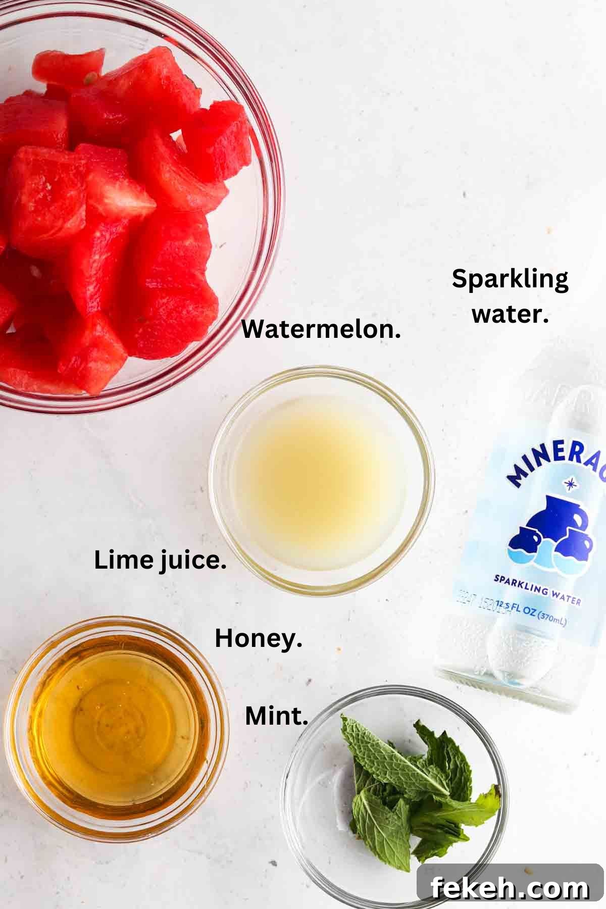 Refreshing Watermelon Mocktail Recipe for Summer Parties 3 Picture of watermelon mocktail ingredients laid out on the counter in bowls.