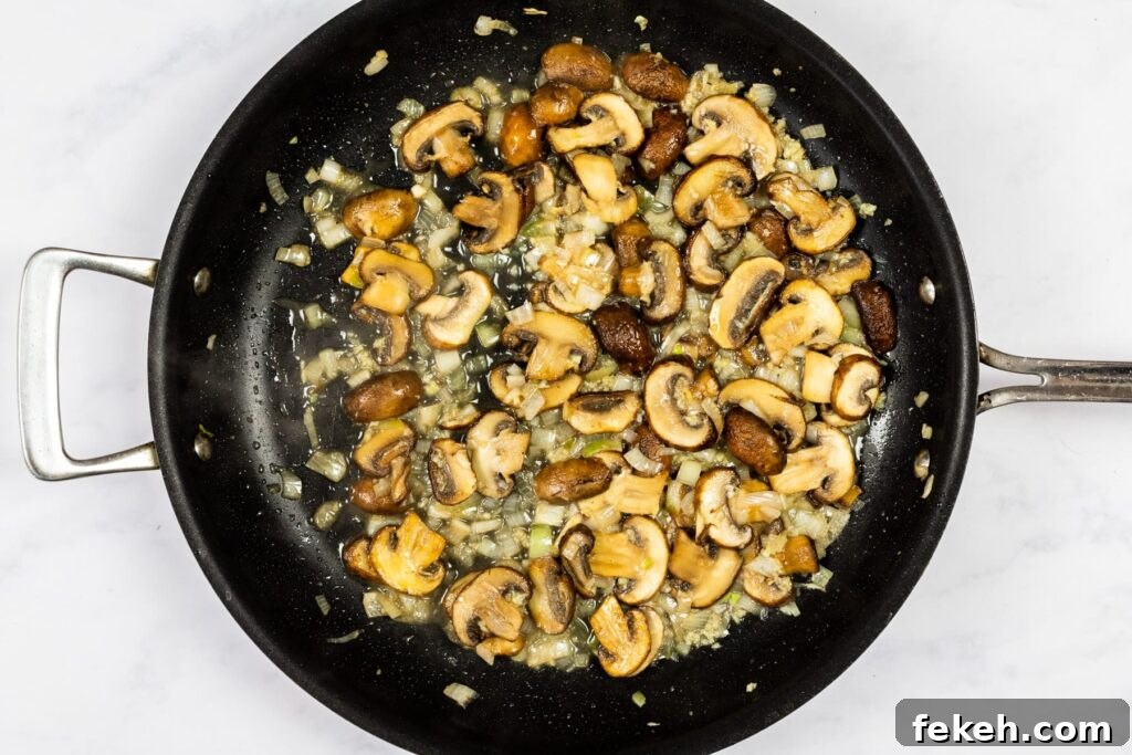 Creamy Garlic Mushroom Pasta Recipe: Rich, Silky Dinner Idea 6 Cooking wine off the mushrooms.