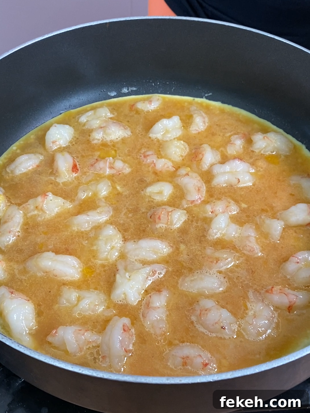 Savory Shrimp Omelette Recipe for Brunch or Quick Dinner 5 Cooking omelette in pan