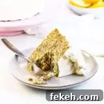 slice of cake with several bites taken out of it on a plate with a fork
