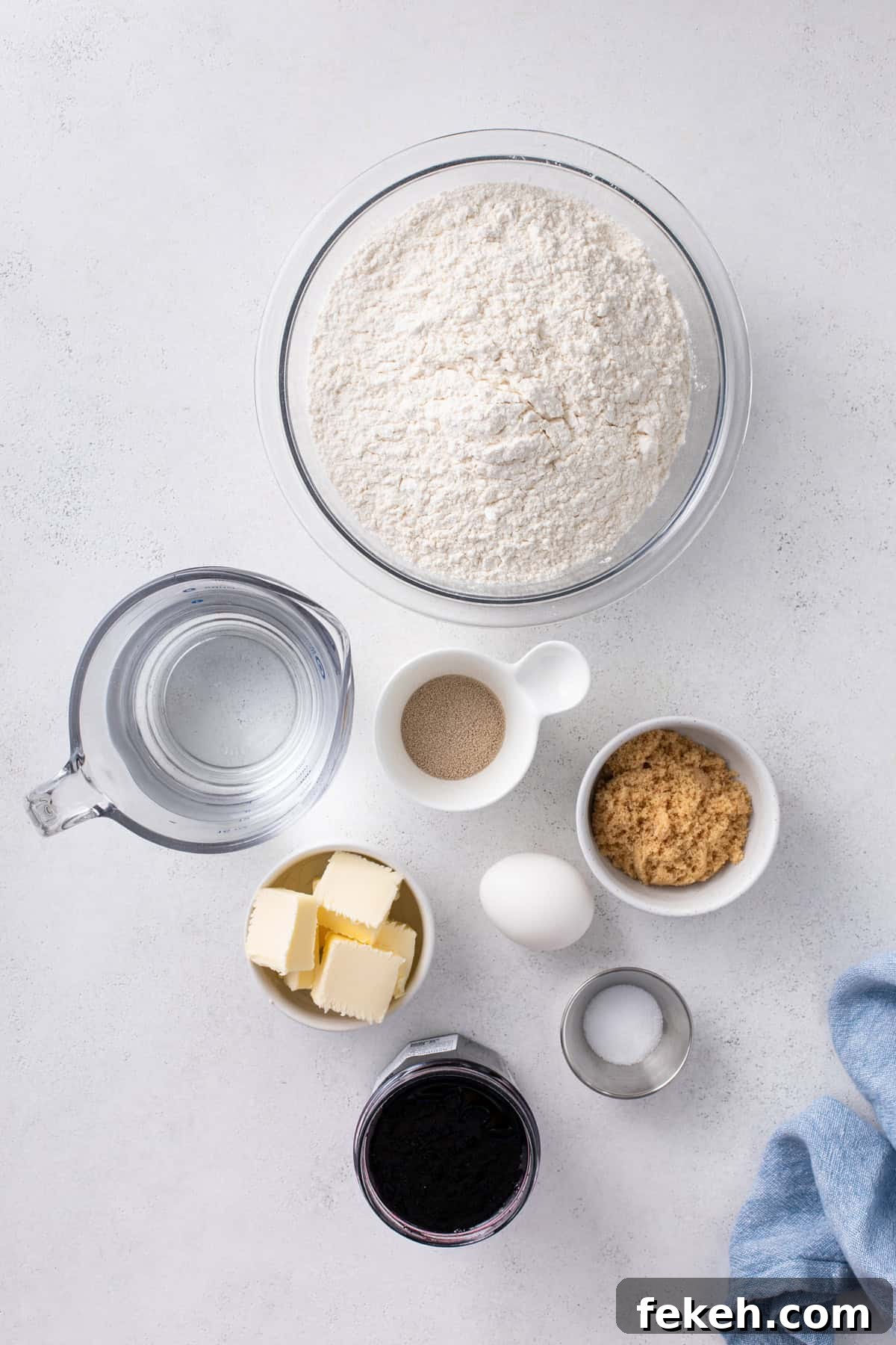 Ingredients for blueberry sweet rolls arranged on a countertop.