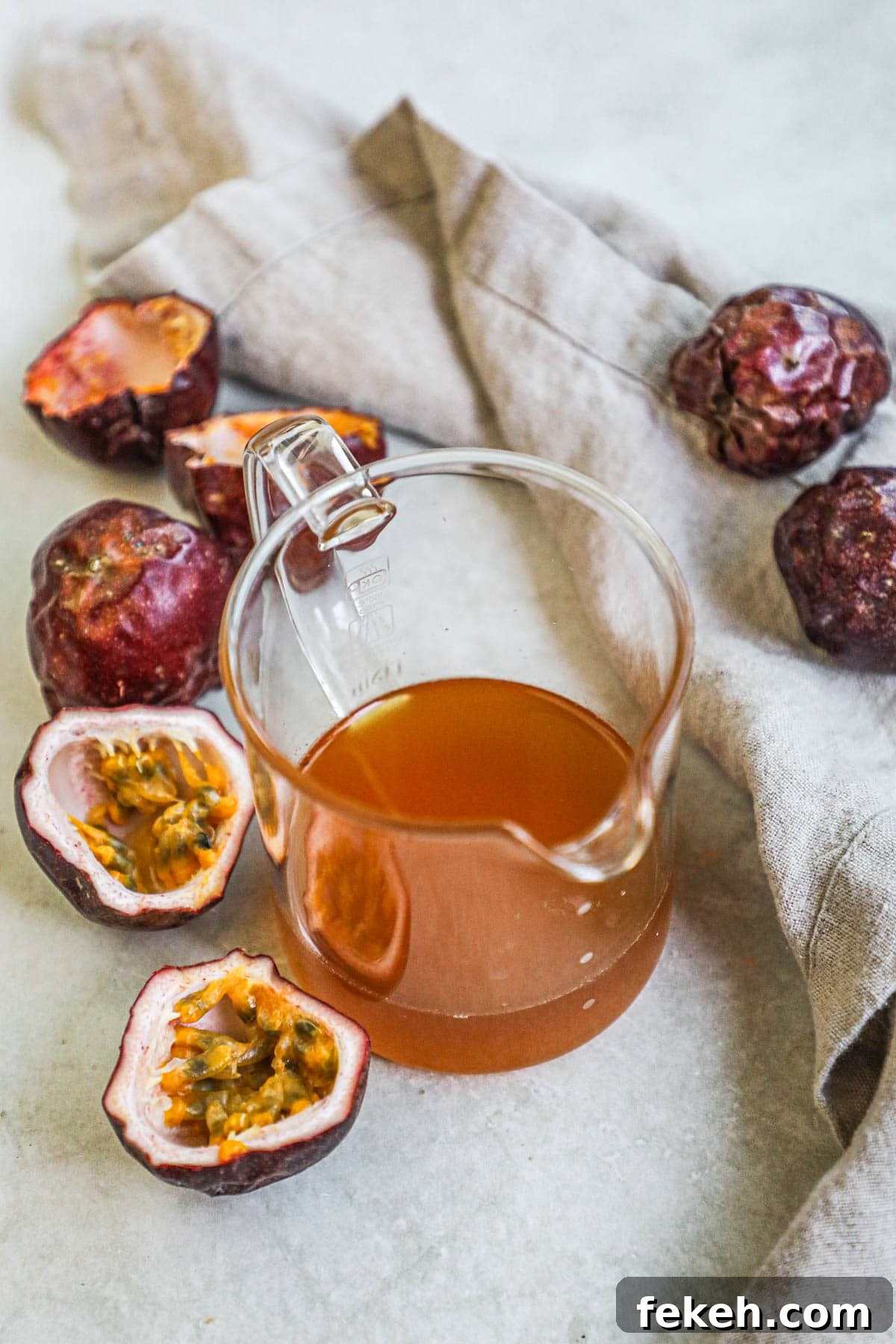 Lilikoi (Passion Fruit) Syrup Recipe for Cocktails & Desserts 2 Passion fruit (lilikoi) honey syrup in a small carafe for serving.