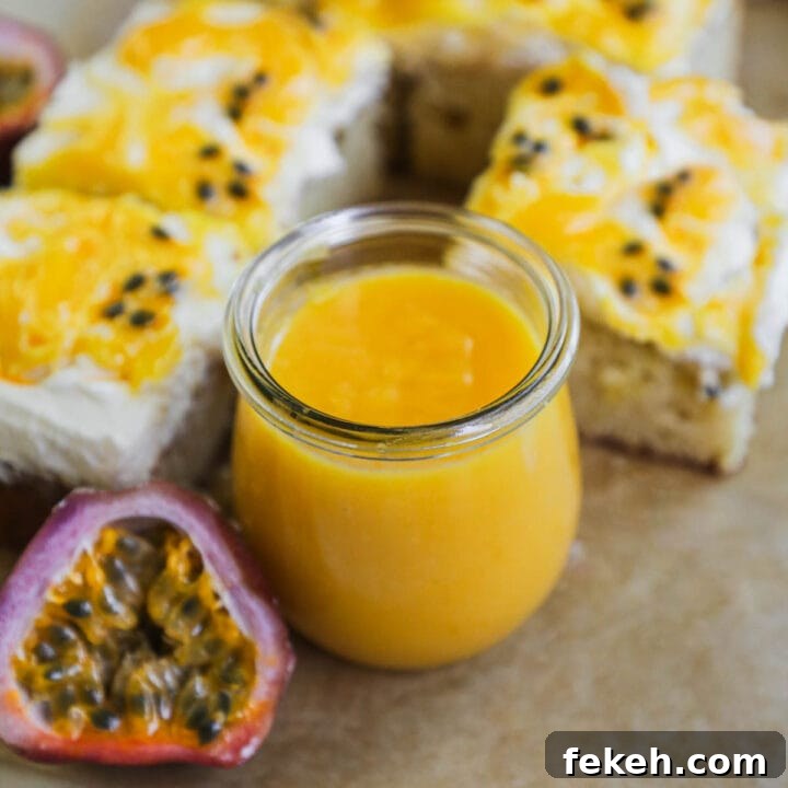 Passion fruit curd in a glass weck jar with slices of passion fruit cake topped with mascarpone whipped cream, lilikoi butter, and fresh passion fruit pulp.