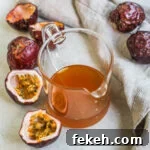 Lilikoi (Passion Fruit) Syrup Recipe for Cocktails & Desserts 10 Passion fruit (lilikoi) honey syrup in a small carafe for serving.