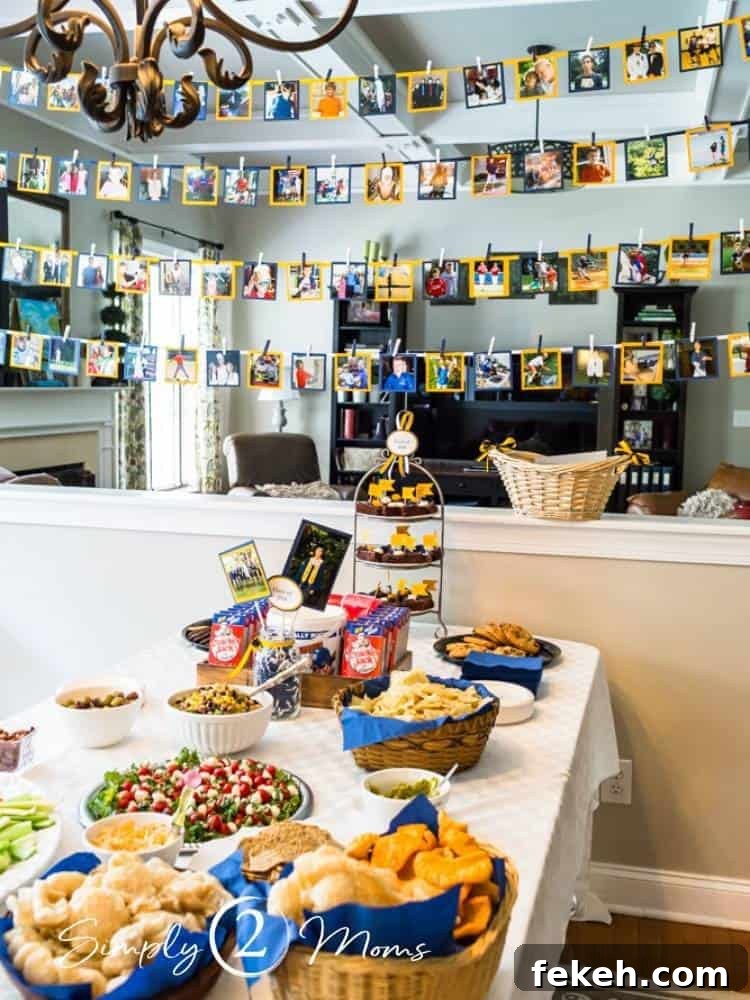 Party food display with a photo banner hanging behind for a graduation party