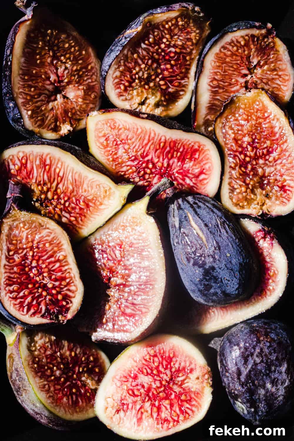 Irresistible Fall Fig Skillet Cake Recipe You’ll Crave 5 Perfectly ripe fresh figs cut in half, revealing theirs soft and jammy interior.