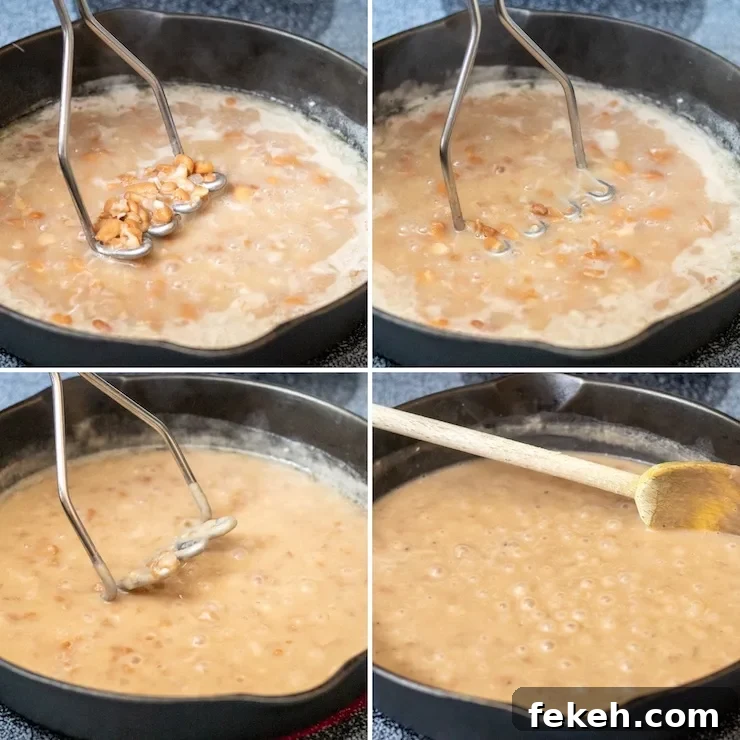 Homestyle Refried Beans Recipe for Creamy, Flavorful Sides 6 Process photo mashing beans until smooth.