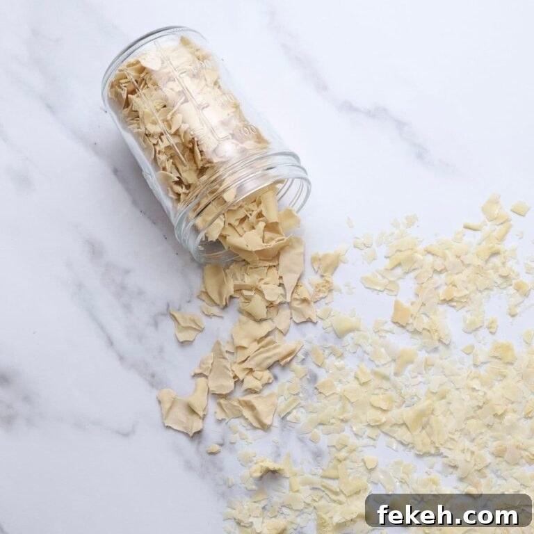 Dehydrating Sourdough Starter: Step-by-Step Guide for Storage 8 A jar of dried sourdough starter that has been tipped out onto the kitchen counter spilling all the dried sourdough starter flakes.
