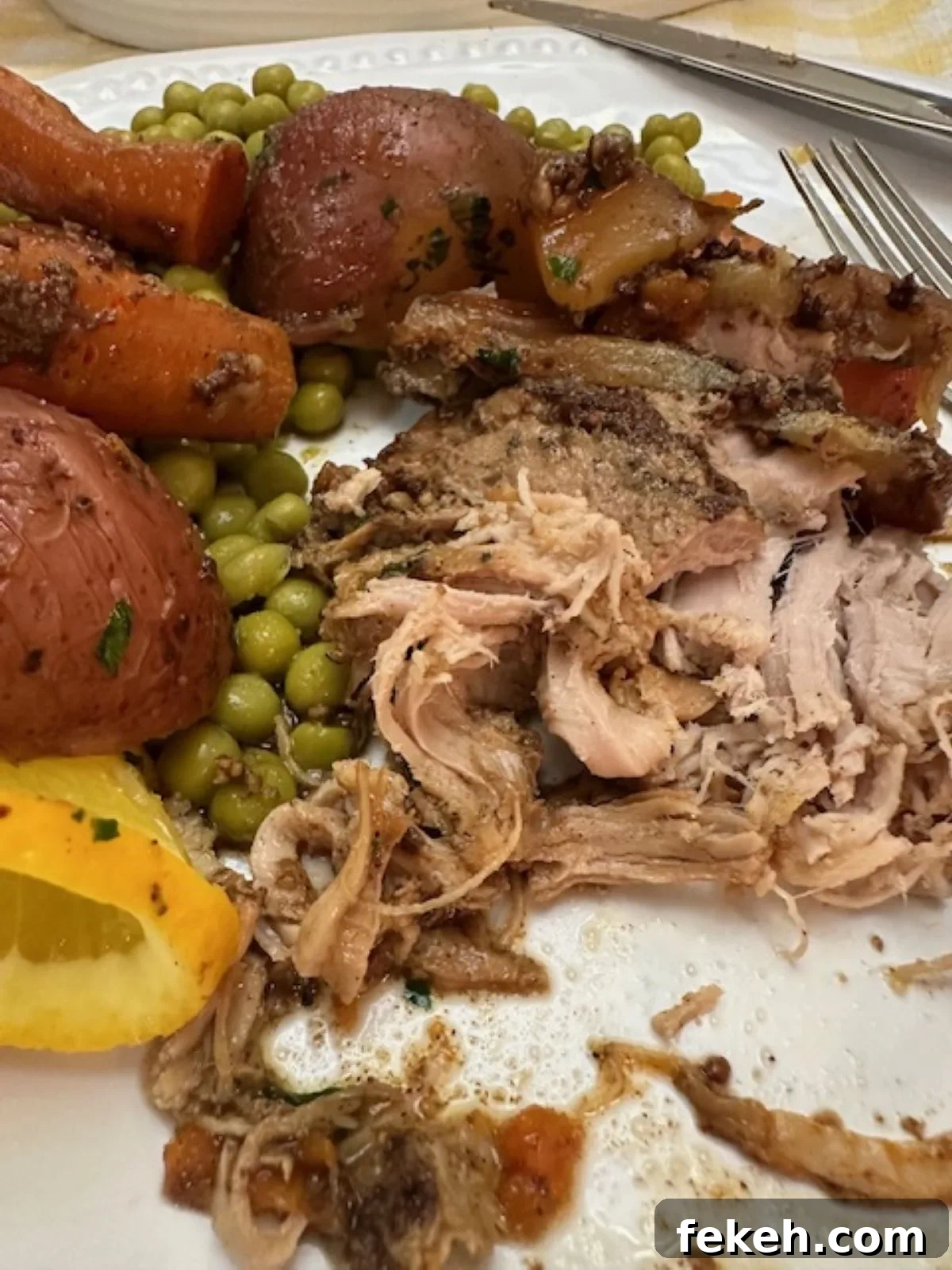 Slow Cooker Pork Tenderloin Recipe the Whole Family Will Love 5 look at this fork-tender slow cooker pork tenderloin on the plate