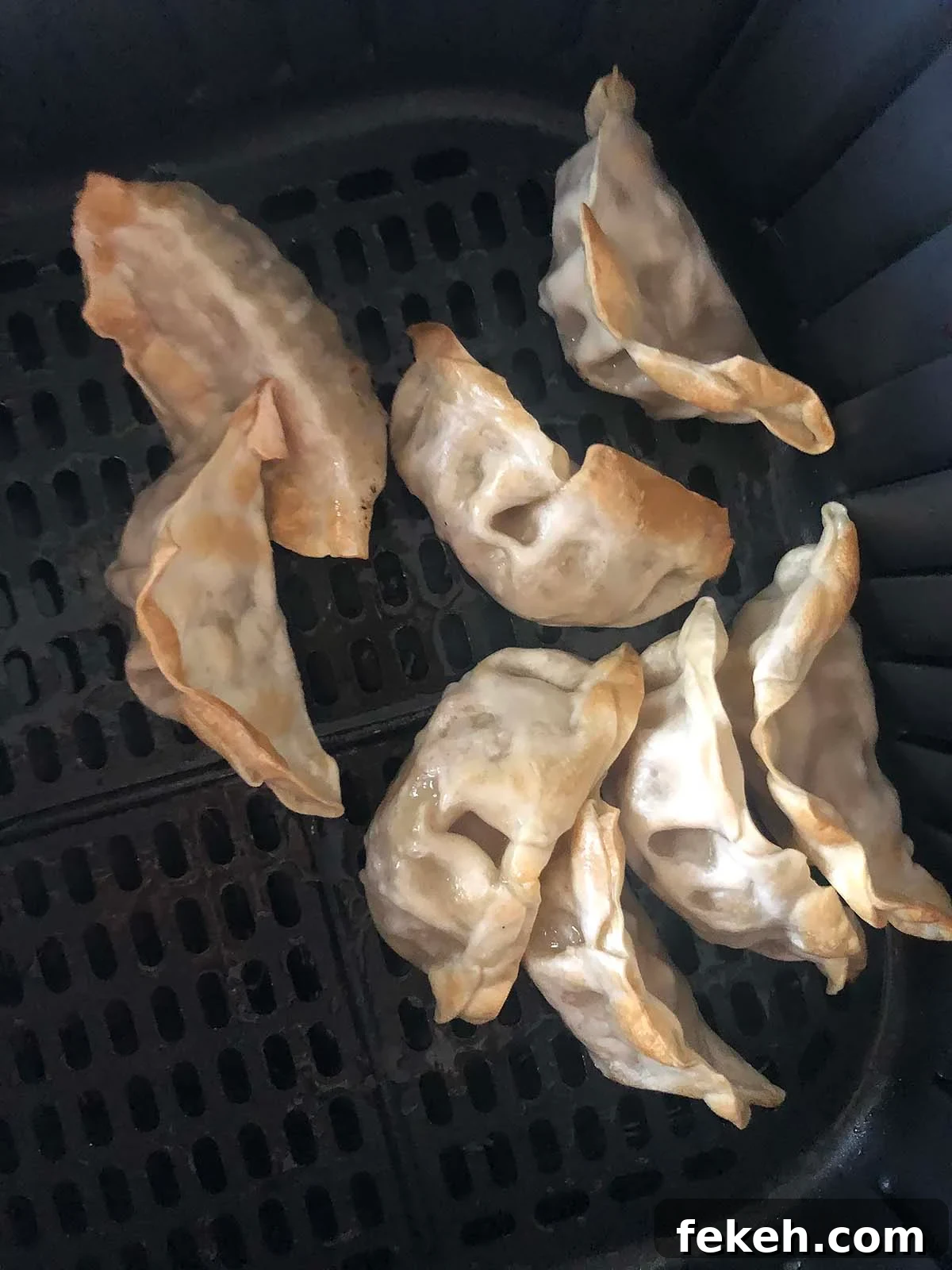 Crispy Air Fryer Frozen Potstickers: Quick Cooking Guide 4 cooked potstickers in air fryer basket