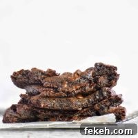 Bakery-Style Double Chocolate Cookies Recipe for Rich, Chewy Treats 5 gooey halves of chocolate cookies stacked on each other