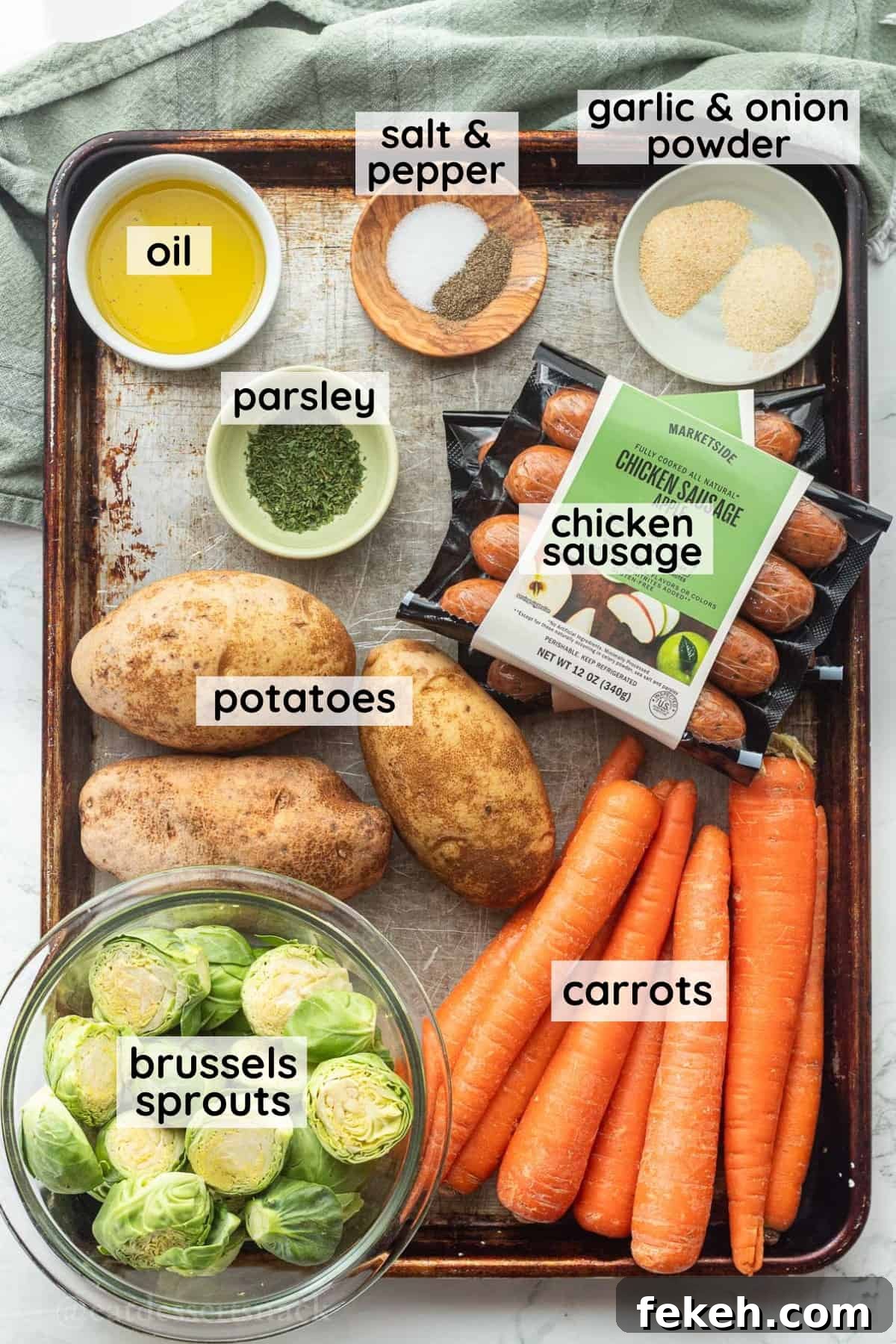 Sheet Pan Chicken Sausage with Roasted Veggies and Potatoes 3 Labeled ingredients for chicken sausage and veggies on metal baking dish.