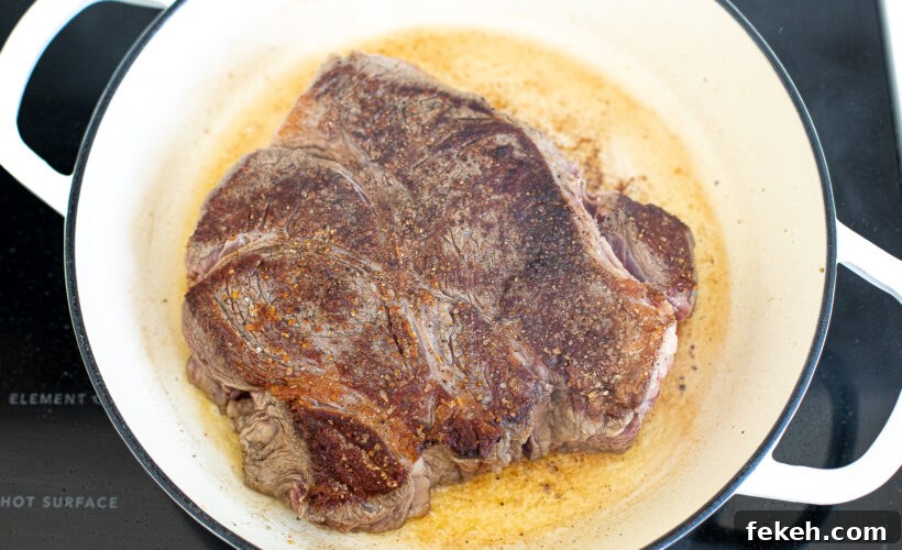 Slow Cooker Italian Beef Sandwiches with Tender Shredded Beef 4 Chuck roast browned in a skillet.