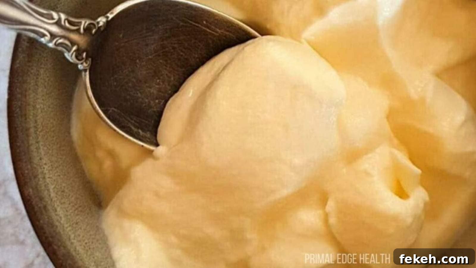 19 Kid-Approved Recipes Kids Beg For (Parents Love Them Too) 16 A spoon dipping into a bowl of cheesecake fluff.