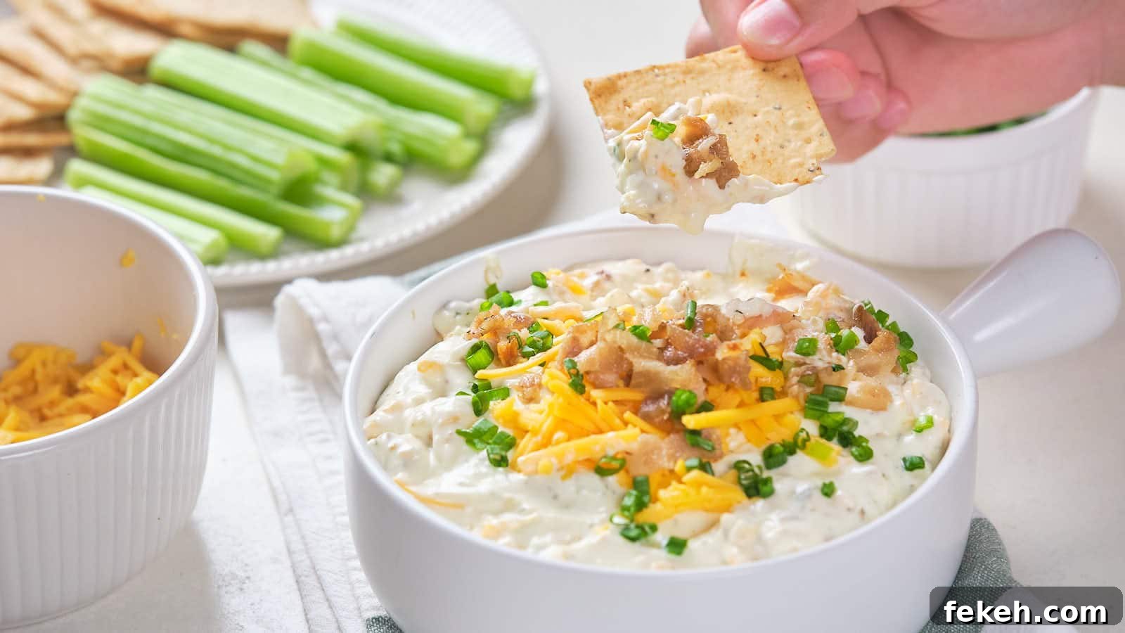 19 Kid-Approved Recipes Kids Beg For (Parents Love Them Too) 8 Bacon cheddar dip with shredded cheddar cheese, bacon bits, and chive garnish.