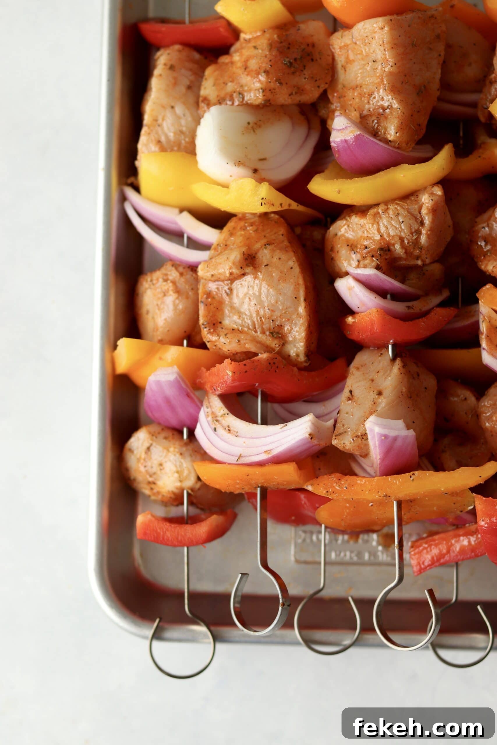 Mediterranean Chicken Kabobs with Lemon, Garlic & Herbs 4 raw chicken with veggies on skewers