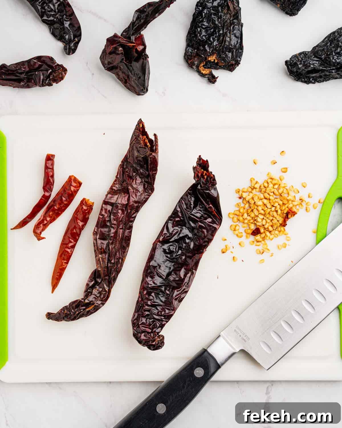Authentic Quesabirria Tacos: How to Make Birria Tacos at Home 5 Removing seeds from dried peppers.