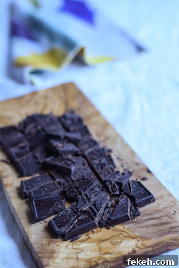 Decadent Chocolate Mint Cookie Recipes for Mint Lovers 6 A wooden board with chopped up chocolate on it