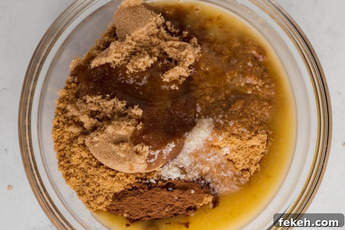 Gluten-Free Graham Cracker Pie Crust Recipe 9 Mixing butter into graham cracker crumbs.