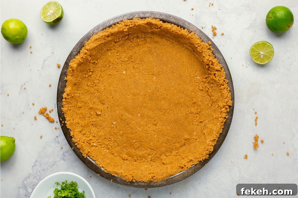Gluten-Free Graham Cracker Pie Crust Recipe 10 Pressed graham cracker crust in a pie pan.
