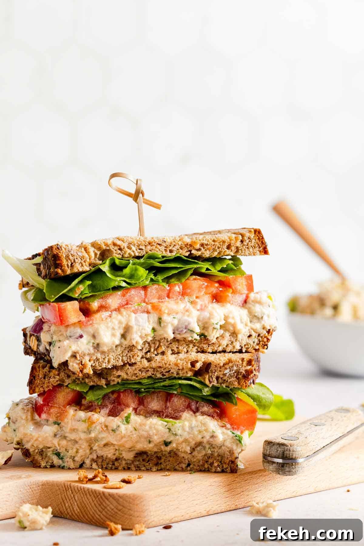 Greek Yogurt Tuna Salad Recipe Without Mayo — High-Protein Lunch 2 Greek yogurt tuna salad sandwich cut in half on wooden board