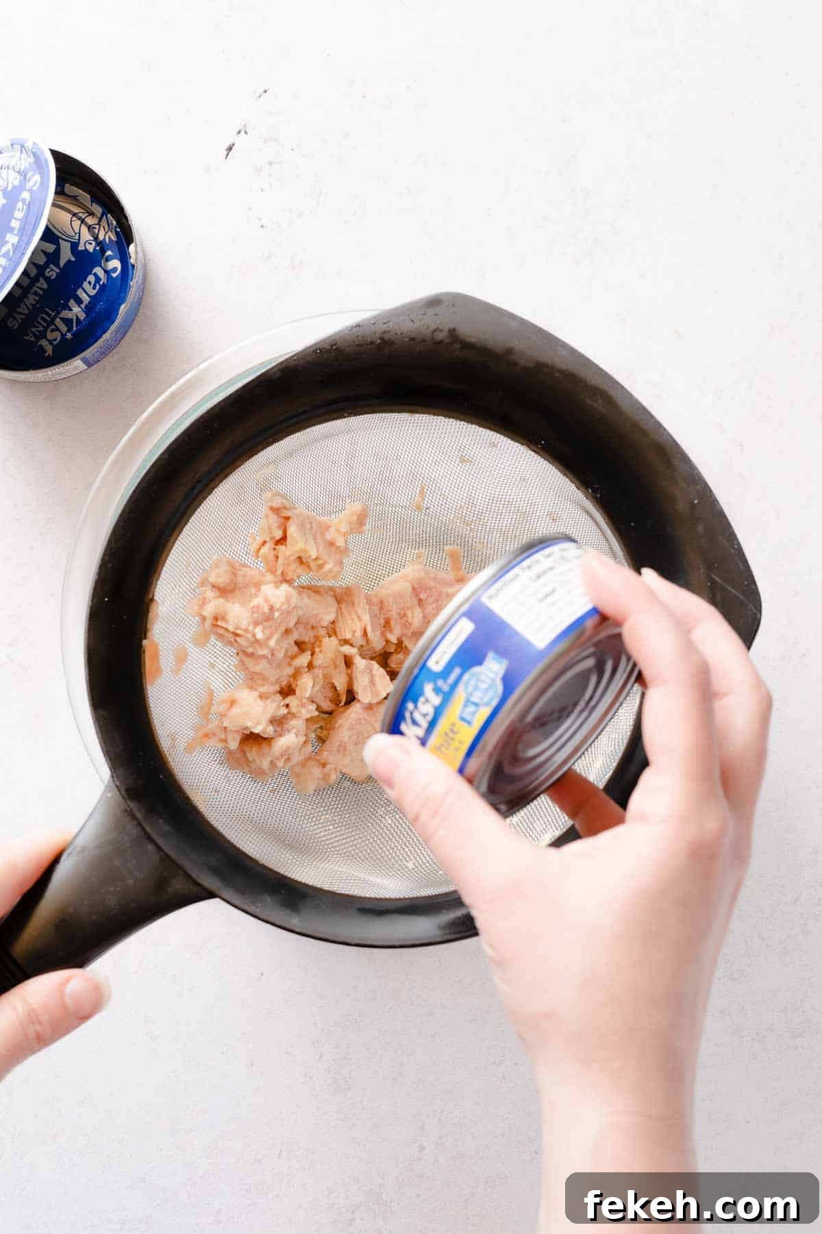 Greek Yogurt Tuna Salad Recipe Without Mayo — High-Protein Lunch 8 tuna being added to strainer from can
