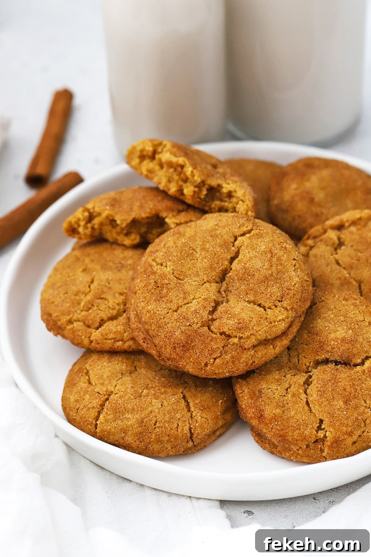 Gluten-Free Pumpkin Snickerdoodle Cookies for Fall Baking 2 Front view of gluten-free pumpkin snickerdoodles on a white plate