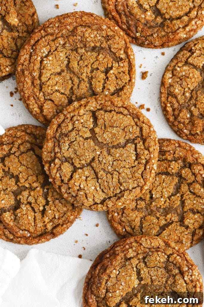 Gluten-Free Pumpkin Snickerdoodle Cookies for Fall Baking 10 chewy gluten-free molasses cookies on a white background