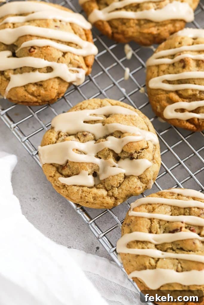 Gluten-Free Pumpkin Snickerdoodle Cookies for Fall Baking 11 gluten-free maple pecan cookies with maple glaze cooling on a wire rack