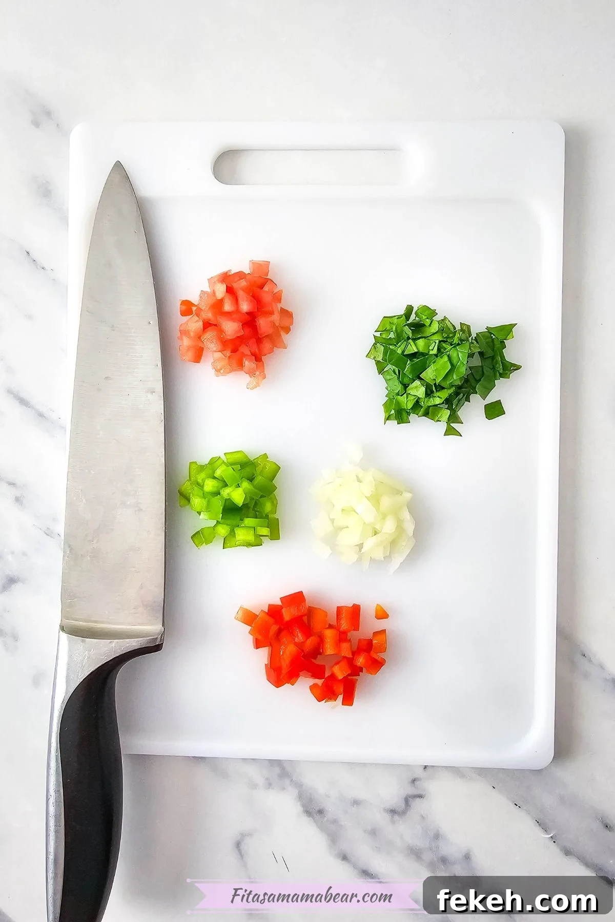 Dairy-Free Gluten-Free Egg Bites Recipe for Meal Prep 4 Spinach, tomatoes, onions, and peppers chopped on a cutting board.