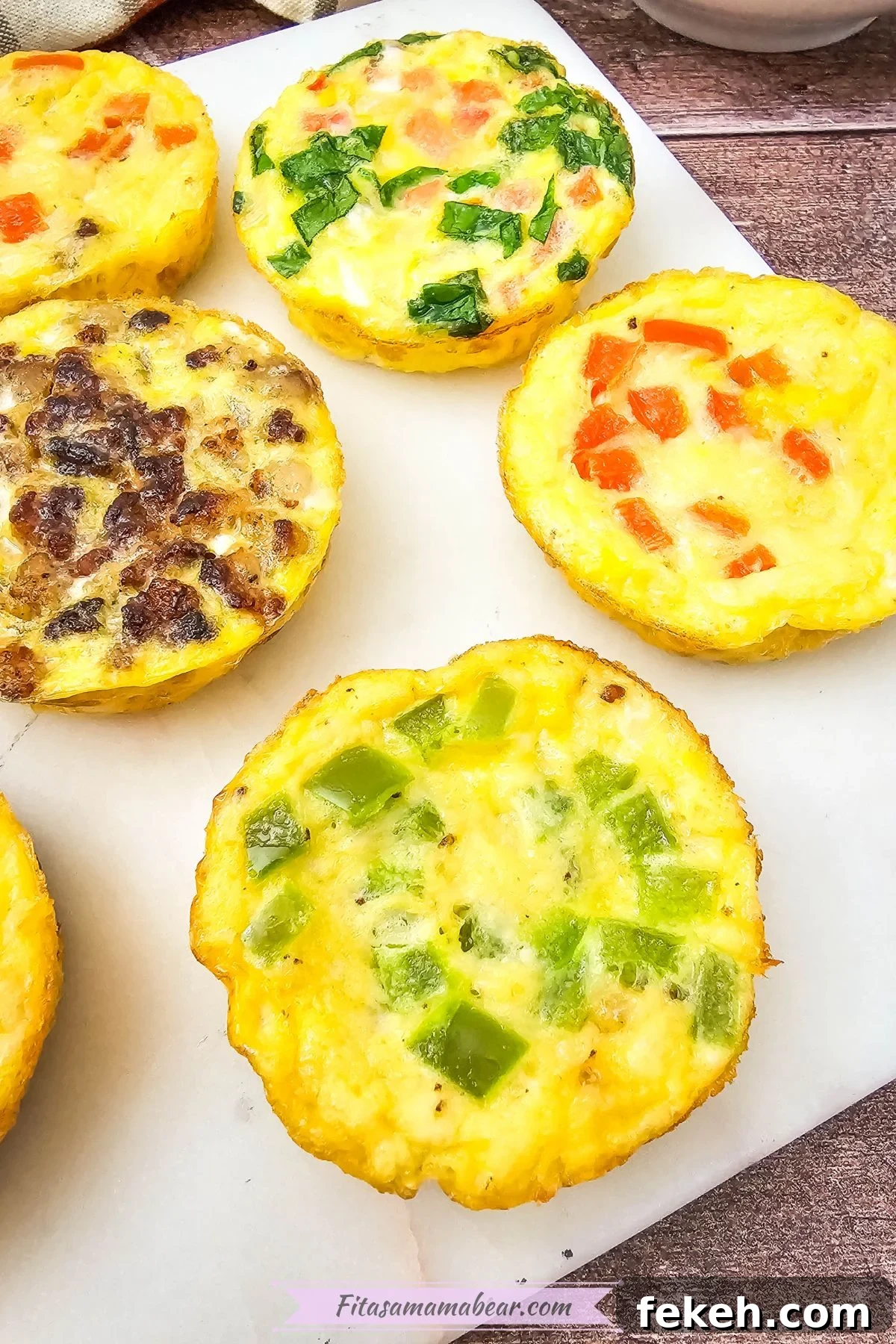 Dairy-Free Gluten-Free Egg Bites Recipe for Meal Prep 8 Mini dairy-free egg bites with bell peppers in them on a white plate.