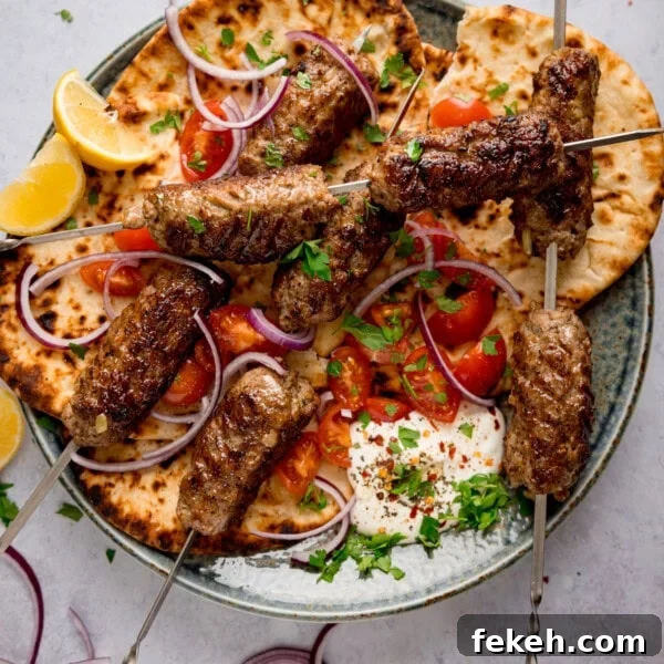Grilled Chicken Souvlaki Recipe: Tender Mediterranean Skewers 11 Grilled lamb kofta skewers on flatbread with red onions and tomatoes