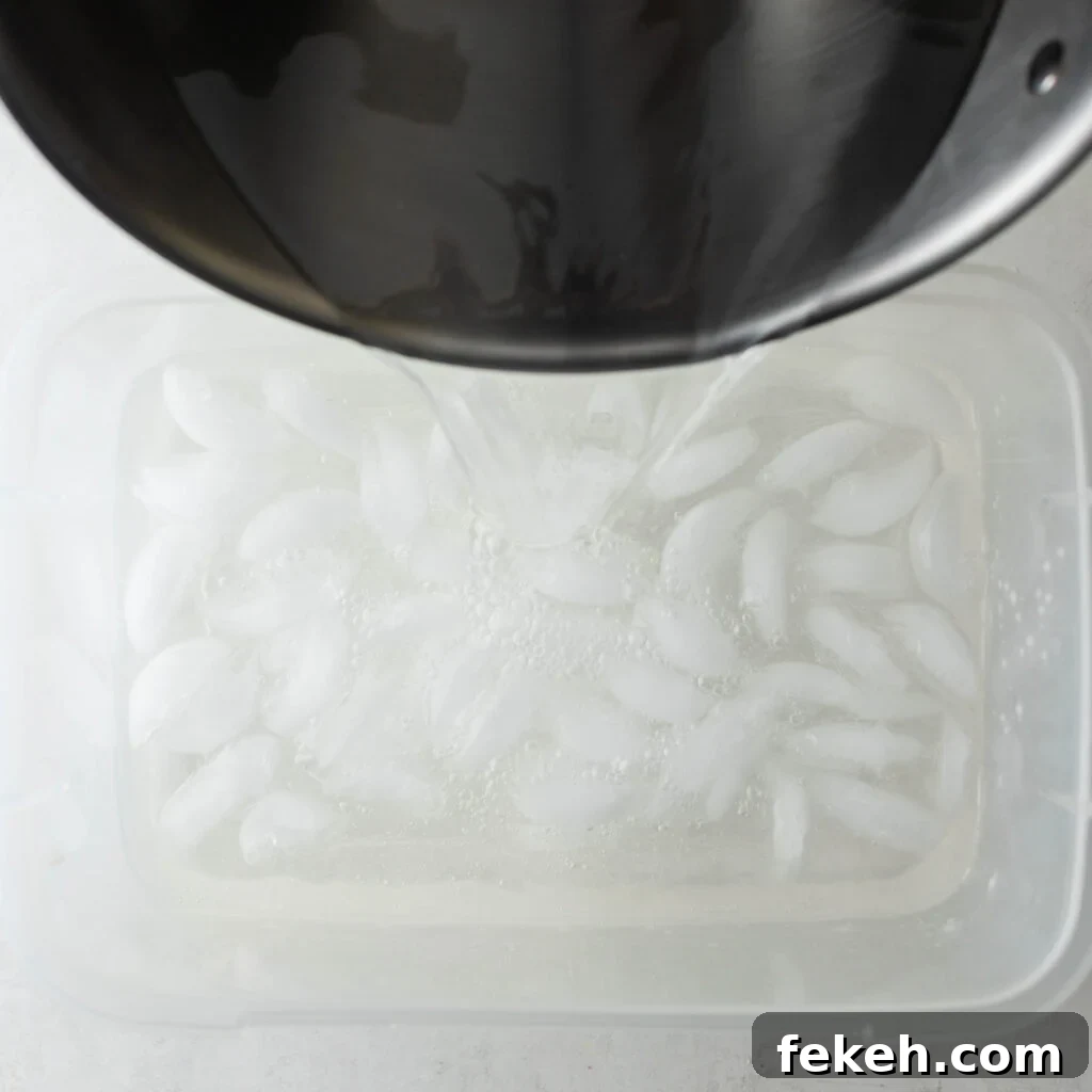 Crispy Southern Fried Chicken Wings Recipe for Perfect Crunch 12 pouring brine mixture into a plastic container with ice