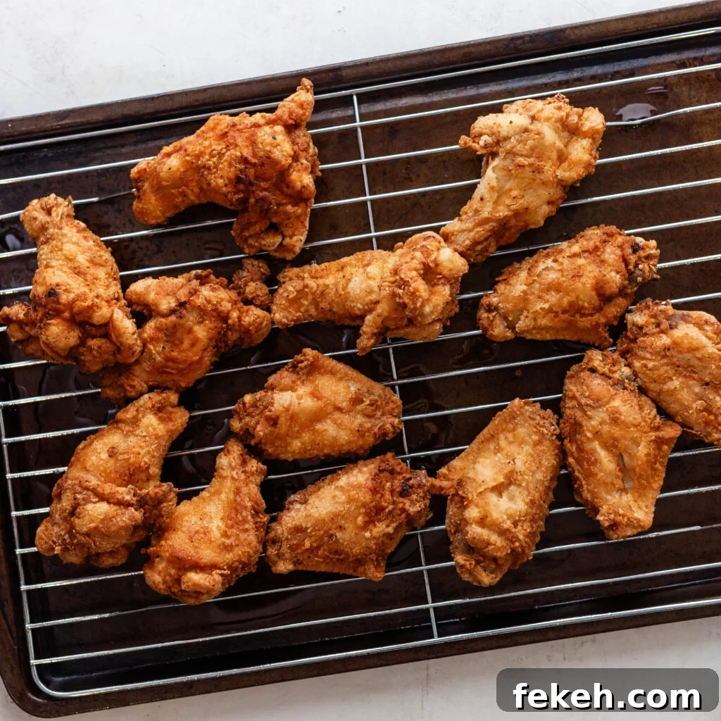 Crispy Southern Fried Chicken Wings Recipe for Perfect Crunch 9 southern fried chicken wings on a wire rack