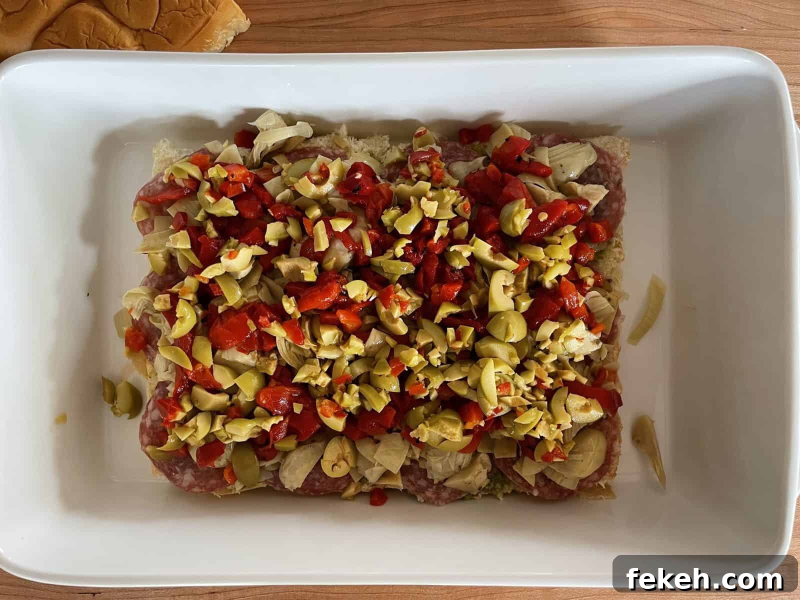 Antipasto Sliders on King's Hawaiian Rolls: Italian Sandwich Recipe 7 Overhead photo of antipasto sliders with artichoke hearts, bell peppers, and sliced olives.