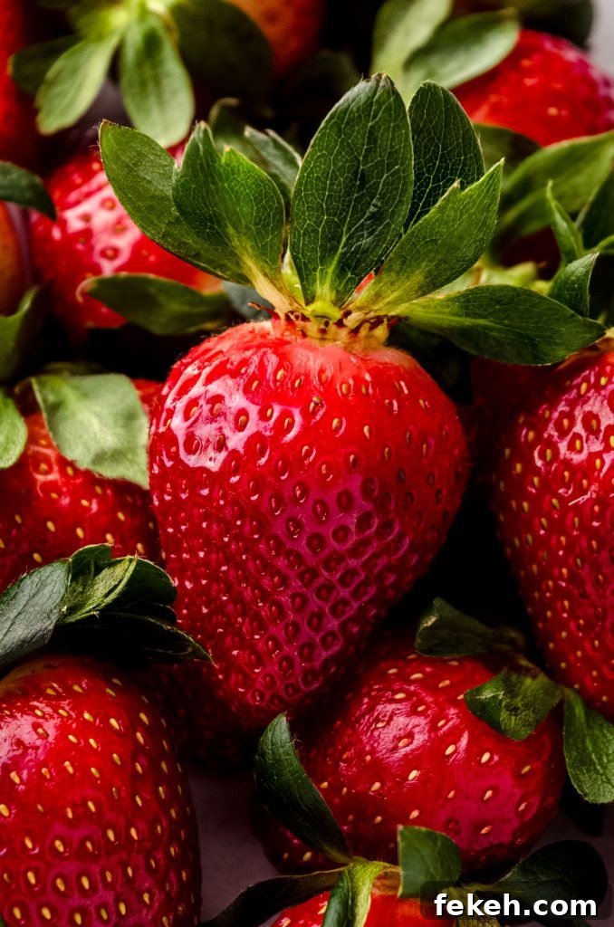 Fresh Strawberry Salsa Recipe: Zesty Fruit Salsa for Chips & Tacos 3 Closeup photo of a fresh strawberry.