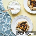 Mini Blueberry Peach Crostatas: Rustic Individual Tart Recipe 5 Mini Blueberry Peach Crostatas Recipe - an easy free form Italian pie with peaches and blueberries from my cookbook Kid Chef Bakes. SnappyGourmet.com