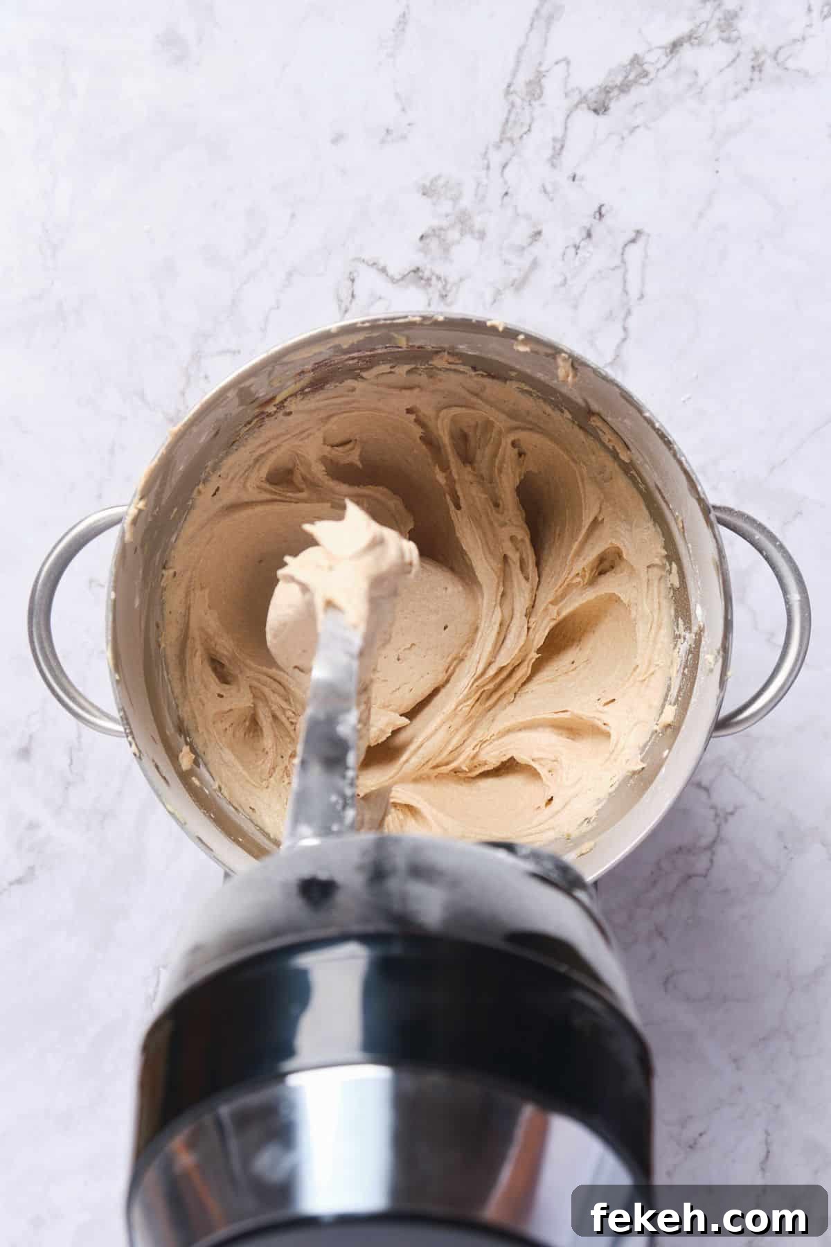 Moist Mini Carrot Cake Bites: Perfect Party Cupcakes 9 Cinnamon cream cheese buttercream frosting being prepared in a stand mixer.