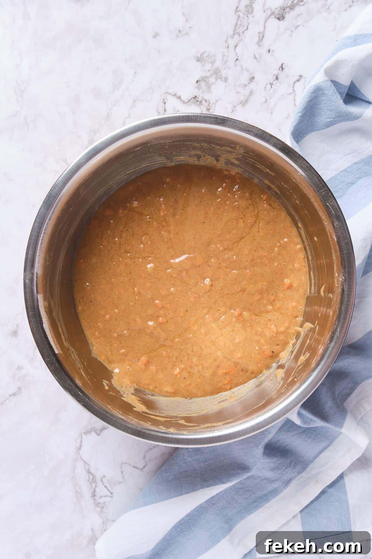 Moist Mini Carrot Cake Bites: Perfect Party Cupcakes 7 Carrot cake batter in a bowl.