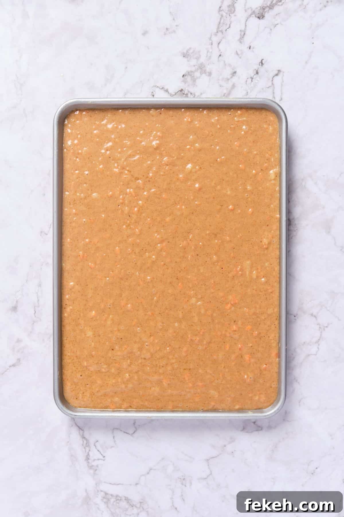 Moist Mini Carrot Cake Bites: Perfect Party Cupcakes 8 Carrot cake batter in the cake pan.