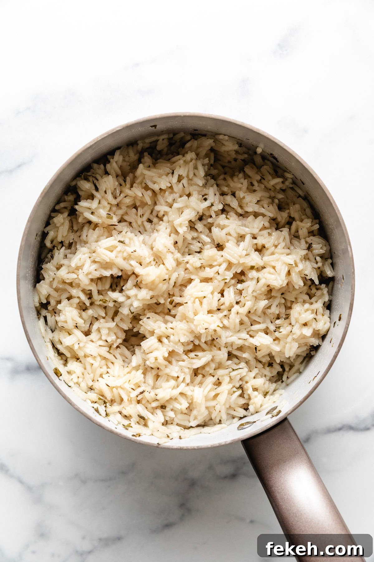 Saucepan filled with herb rice.