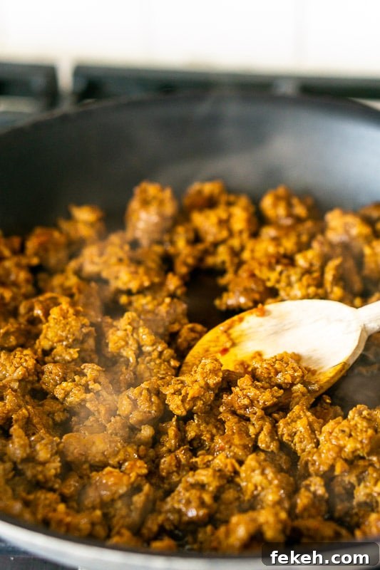 Baked Chorizo and Butternut Squash Chile Rellenos Recipe 5 Browning the chorizo in a large nonstick skillet.