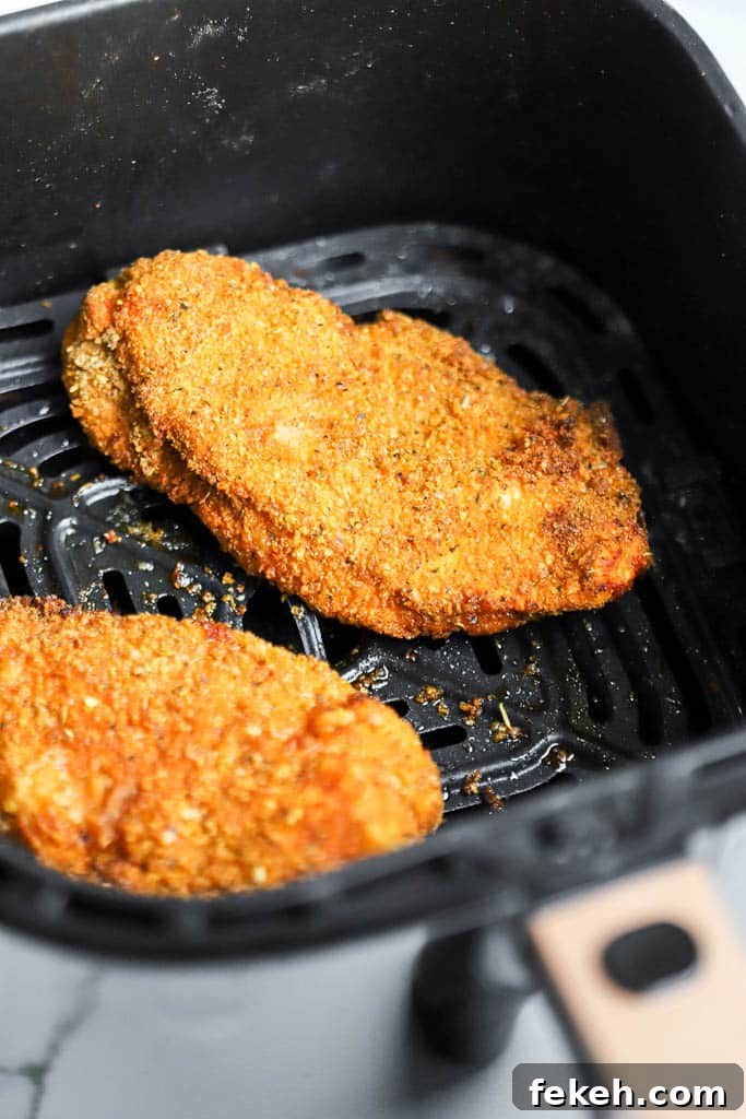 Crispy Air Fryer Chicken Burger Recipe for Juicy Patties 4 chicken burger patties in air fryer basket